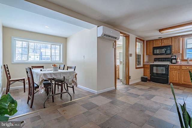 kitchen with a wall unit AC and electric range