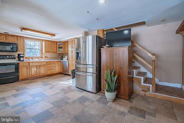 kitchen with appliances with stainless steel finishes and sink