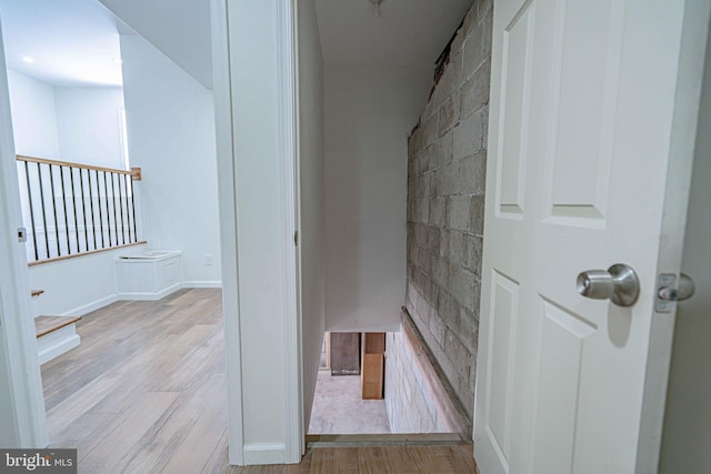 corridor with light wood-type flooring