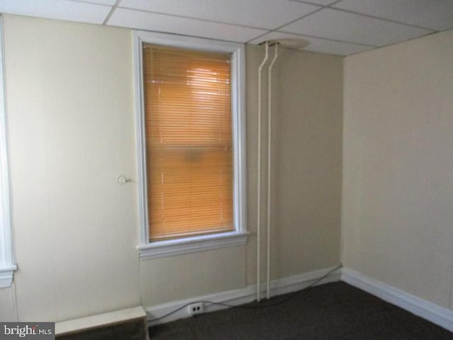 spare room featuring a drop ceiling