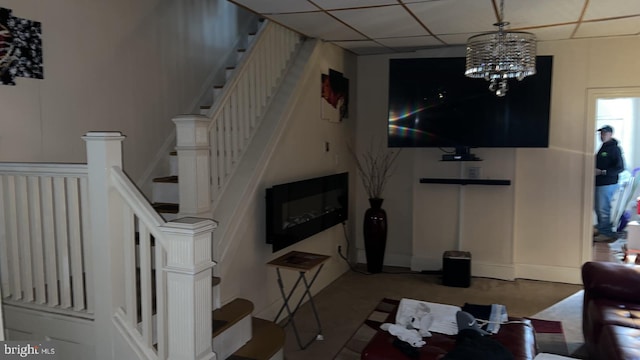 living room with an inviting chandelier