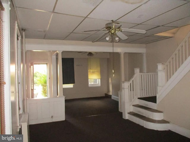 foyer entrance with ceiling fan