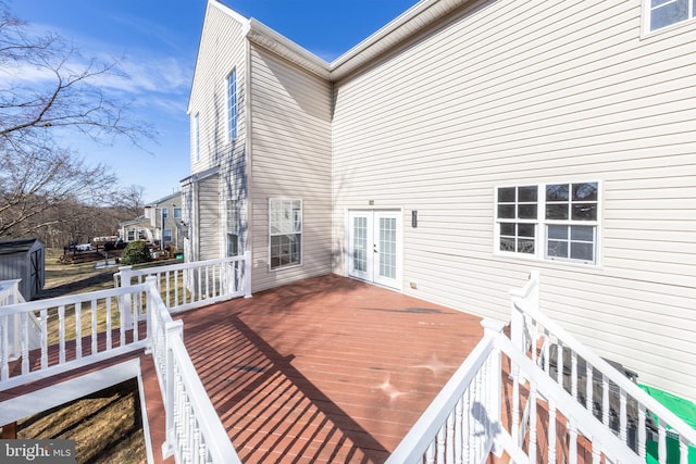 wooden deck featuring french doors