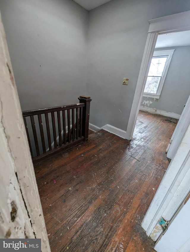 stairs with wood-type flooring