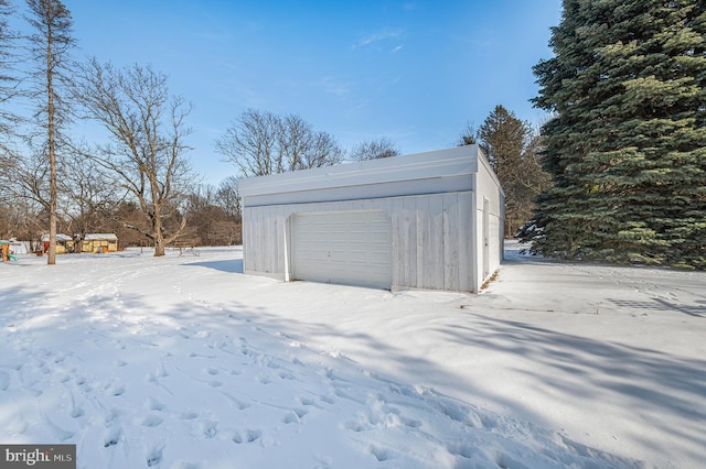 view of snow covered garage