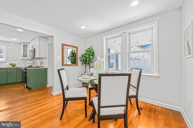 dining room with light hardwood / wood-style floors