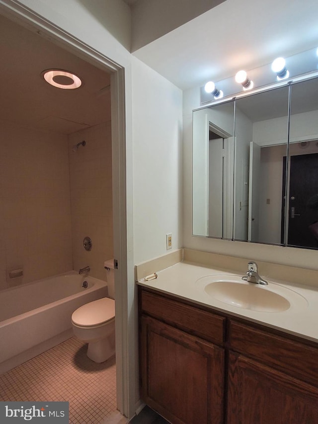 full bathroom featuring vanity, toilet, and tiled shower / bath combo