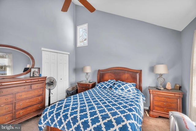 bedroom with light colored carpet, a closet, high vaulted ceiling, and ceiling fan