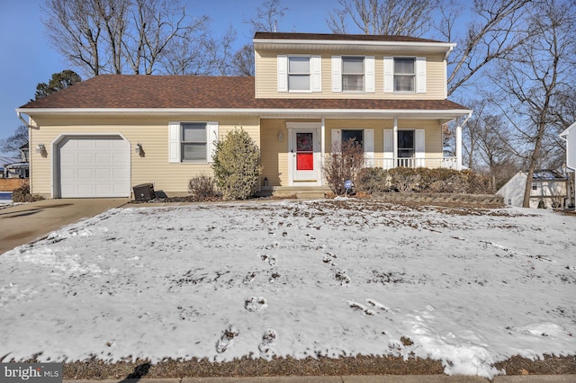 view of front property with a garage and covered porch