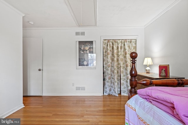 bedroom with crown molding and wood-type flooring