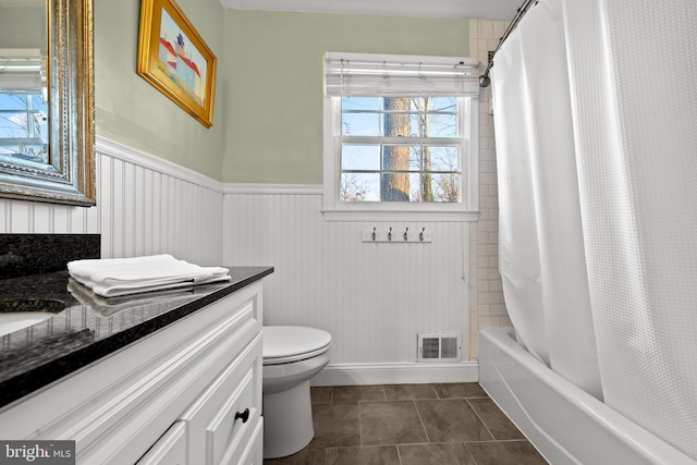 full bathroom featuring shower / tub combo with curtain, vanity, toilet, and tile patterned floors