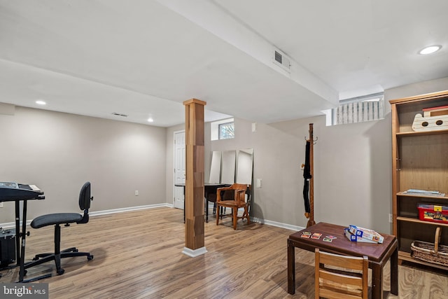 office with light wood-type flooring