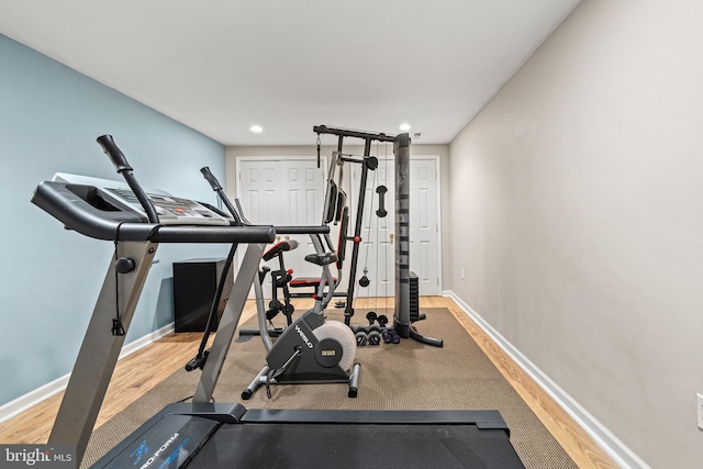 workout area with hardwood / wood-style flooring