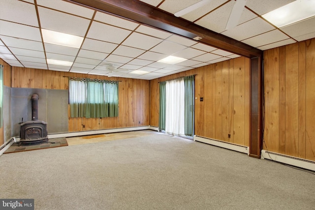 unfurnished living room with carpet flooring, plenty of natural light, and baseboard heating