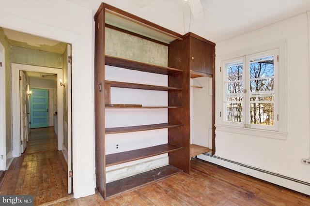 closet featuring baseboard heating