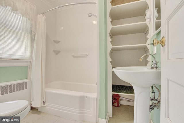 bathroom with toilet, tile patterned floors, radiator, and shower / bath combo with shower curtain