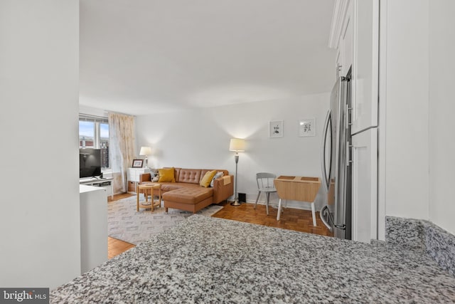 living room featuring light parquet floors