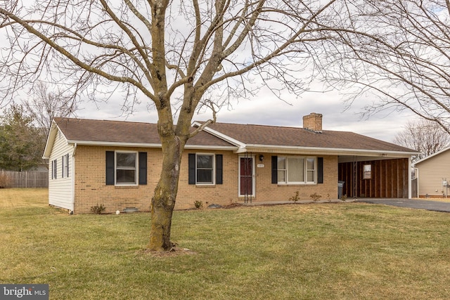 single story home featuring driveway, a chimney, crawl space, a front lawn, and brick siding