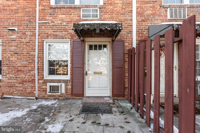 doorway to property with a patio area