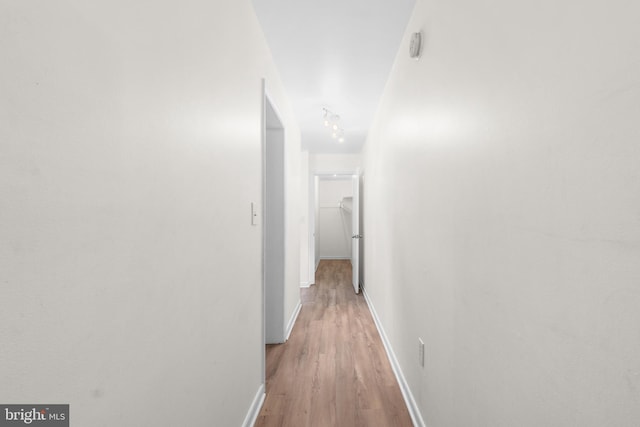 corridor featuring light hardwood / wood-style floors