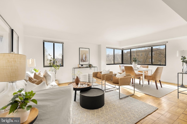 living room with light parquet flooring and a wealth of natural light