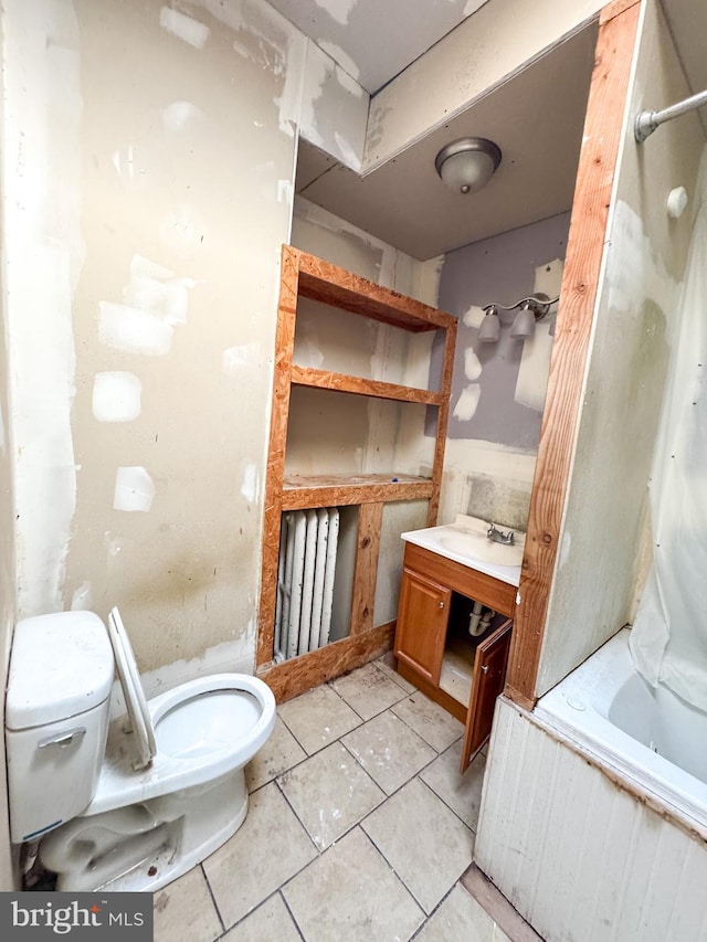 bathroom featuring tile patterned floors, toilet, and shower / tub combination