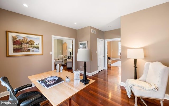 office area with recessed lighting, wood finished floors, visible vents, and baseboards