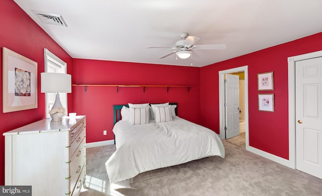 bedroom with carpet, visible vents, ceiling fan, and baseboards