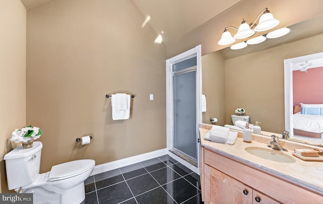 bathroom with a stall shower, baseboards, toilet, tile patterned flooring, and vanity