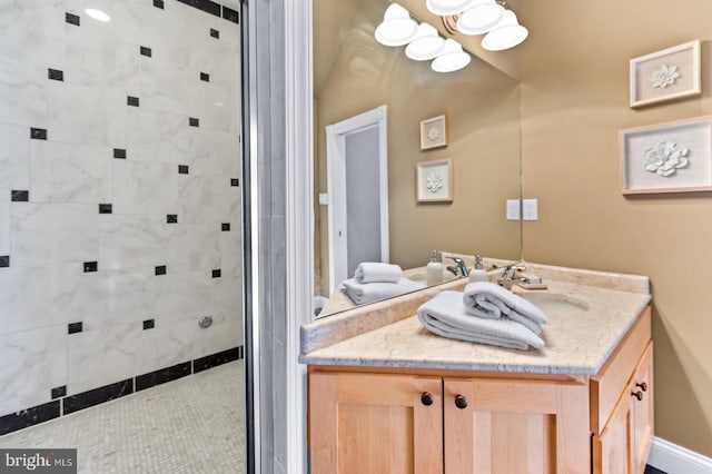 full bathroom with a stall shower and vanity