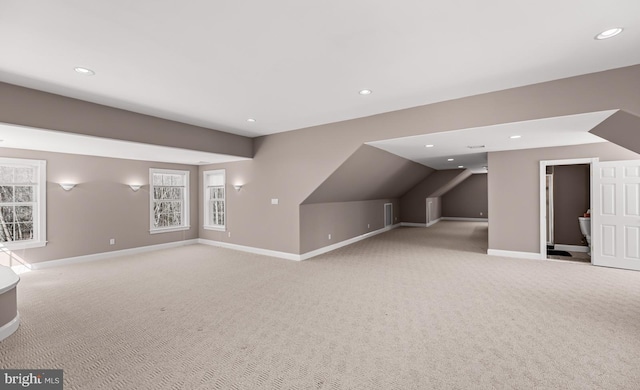 additional living space featuring lofted ceiling, recessed lighting, carpet flooring, and baseboards