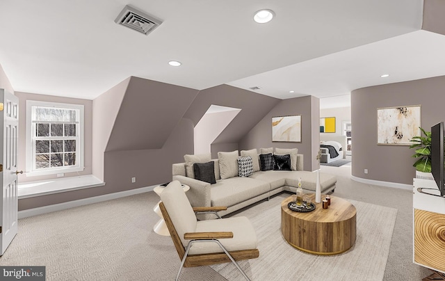 carpeted living area with recessed lighting, visible vents, lofted ceiling, and baseboards