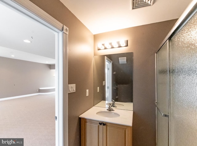 full bath featuring recessed lighting, visible vents, a shower with shower door, vanity, and baseboards