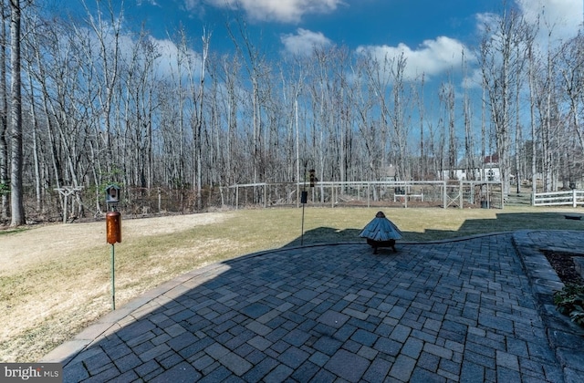 surrounding community featuring a fenced backyard, a yard, and a patio