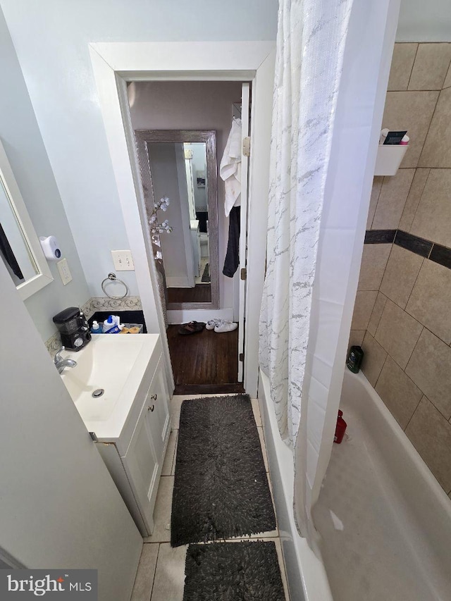 bathroom with tile patterned flooring and vanity