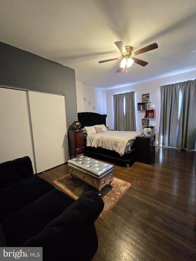 bedroom featuring dark hardwood / wood-style floors and ceiling fan