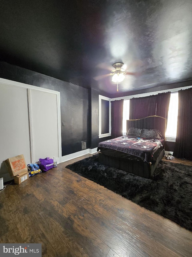 bedroom featuring hardwood / wood-style flooring and ceiling fan