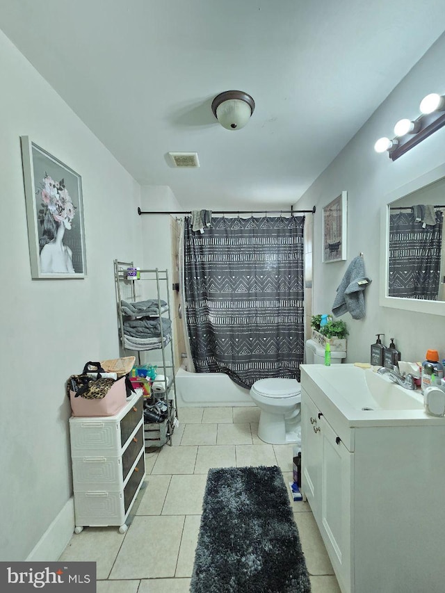 full bathroom with vanity, tile patterned floors, toilet, and shower / bath combo