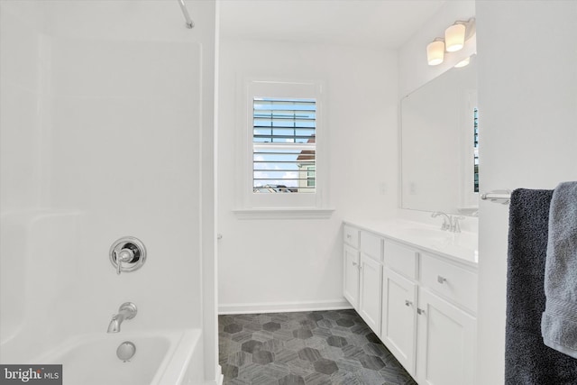 bathroom with vanity and  shower combination