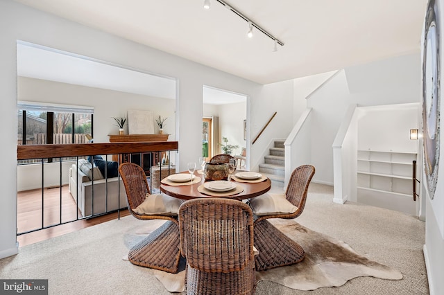 view of carpeted dining area