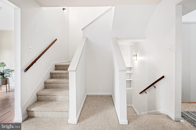 stairway with carpet flooring