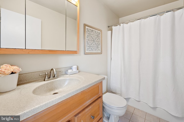 full bathroom featuring tile patterned flooring, vanity, shower / tub combo, and toilet