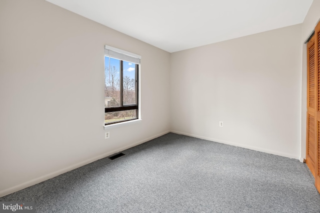 view of carpeted spare room