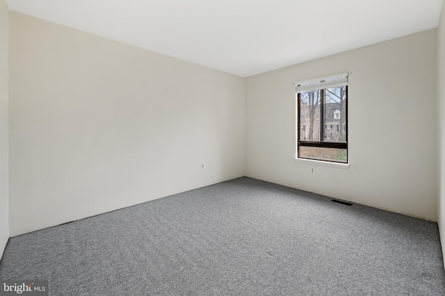 unfurnished room featuring carpet flooring