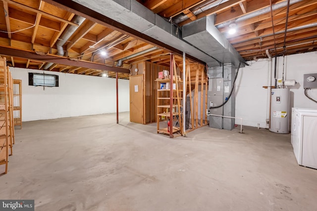 basement featuring washer / clothes dryer, electric water heater, and heating unit