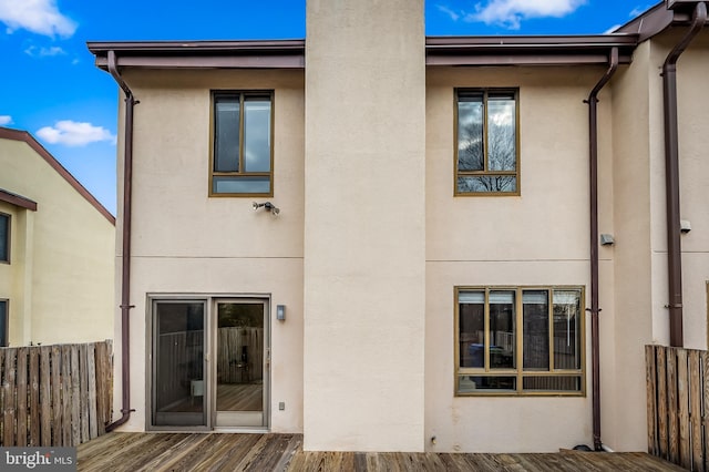 back of house featuring a deck