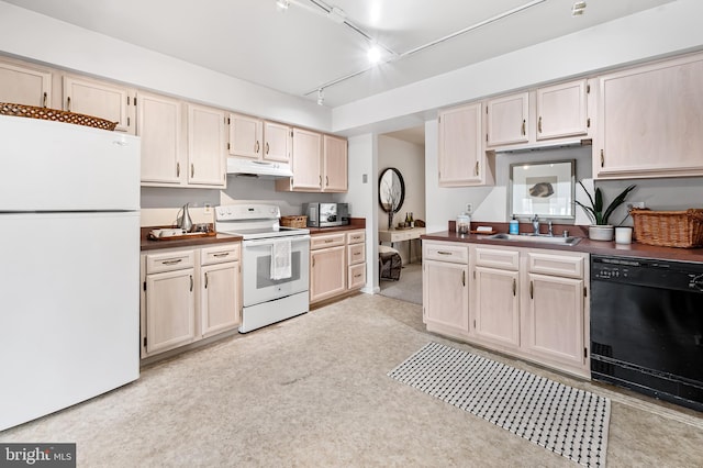 kitchen featuring sink and white appliances