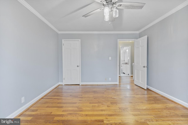 unfurnished room featuring ornamental molding, ceiling fan, and light wood-type flooring