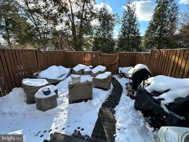 view of yard layered in snow