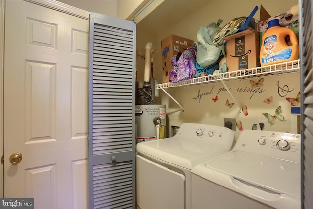 laundry room with independent washer and dryer and water heater